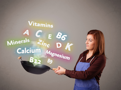 Young Woman Stir Frying image of Vitamins and Minerals signifying the importance of home cooking and getting all nutrients in your diet