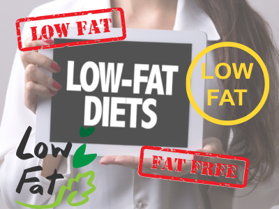 Different low fat diet signs displayed by a woman